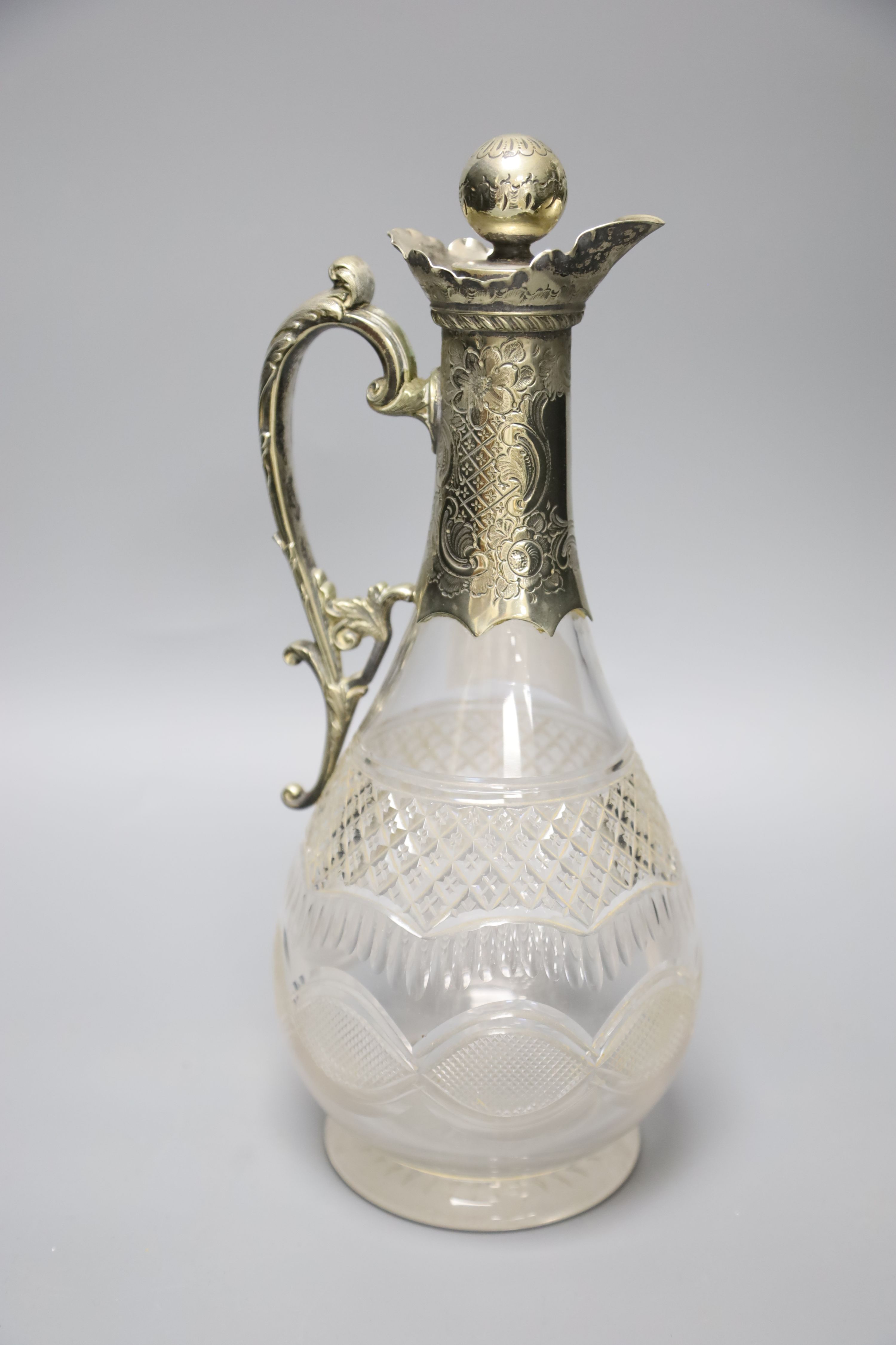 A Victorian plated tureen and cover and a claret jug